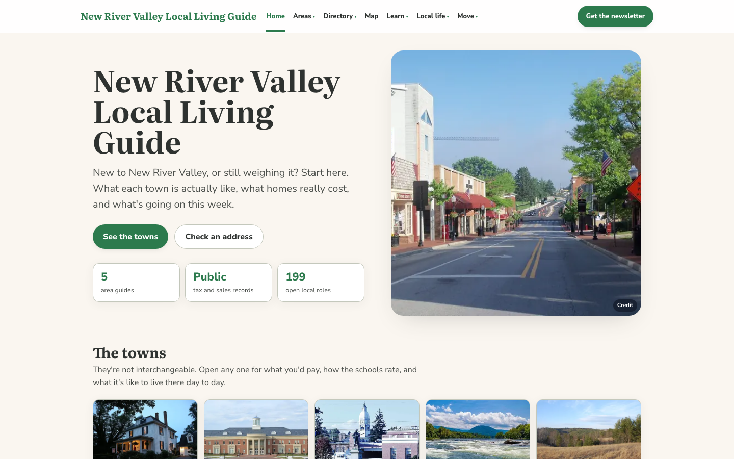 The home page of the New River Valley Local Living Guide as captured on 2026-10-15: the headline, buttons to see the towns or check an address, three summary figures, a photograph of a town main street, and the start of the list of towns.